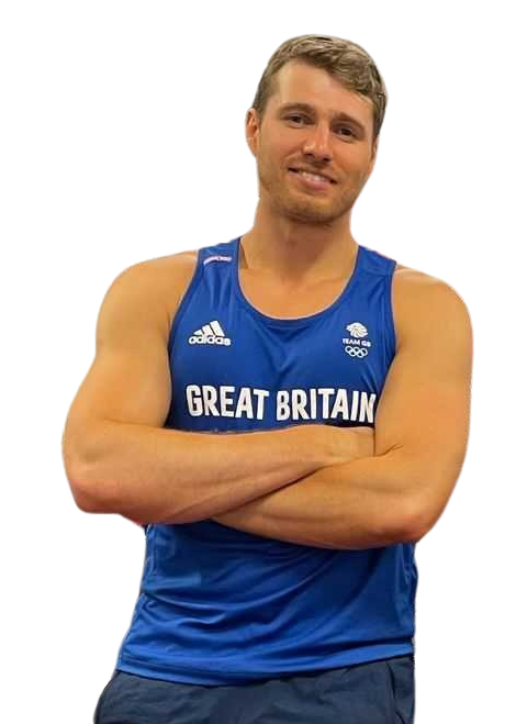 Cutout image of Rory Gibbs with his arms crossed smiling into the camera
